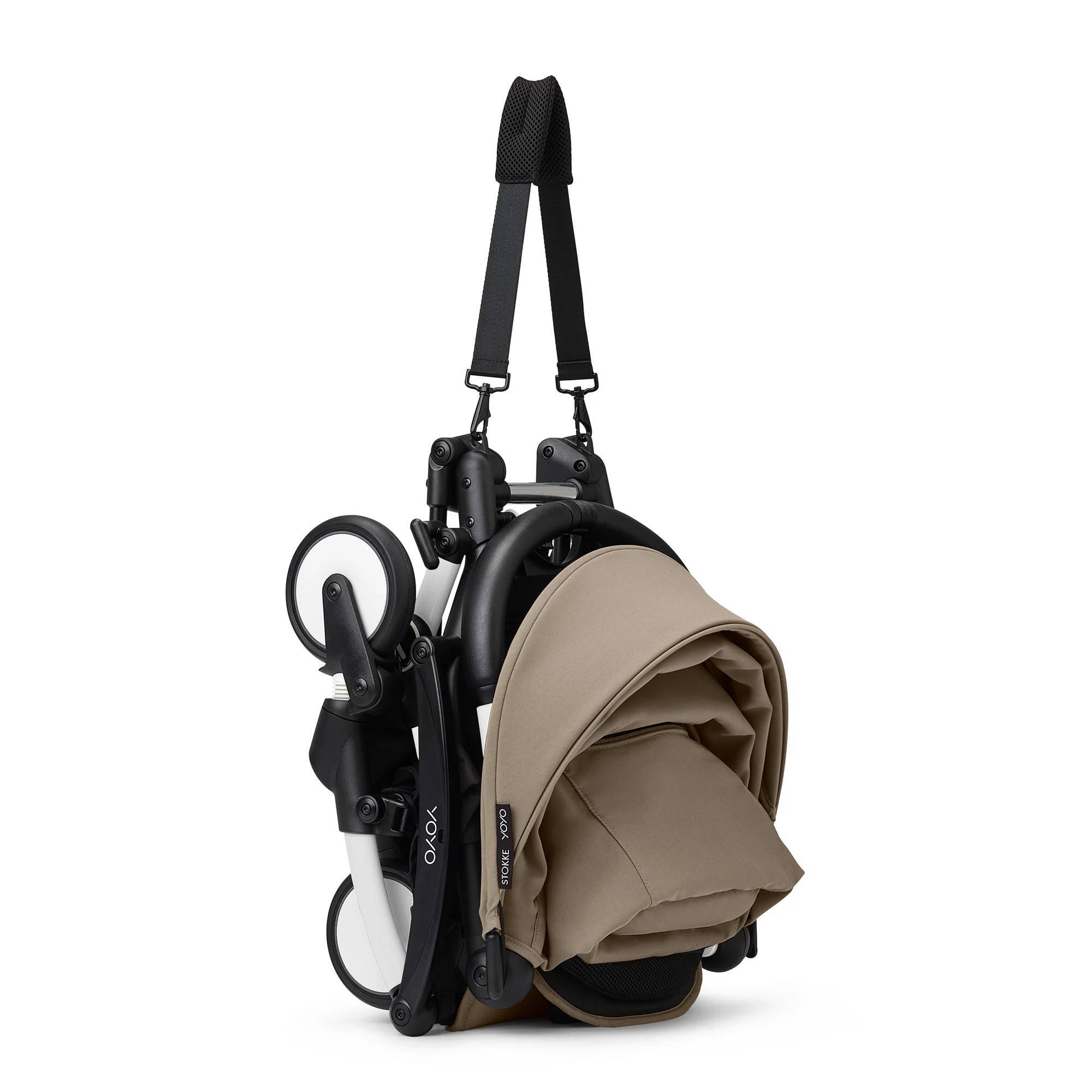 Коляска 2 в 1 Stokke YOYO Newborn Shell White, бежева складена з ременем